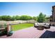 Inviting wooden deck with comfortable seating and a stone fire pit, ideal for outdoor entertaining and relaxation at 3834 Donnington Cir, Castle Rock, CO 80104