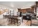 Well-appointed kitchen with an island, bar seating, dark wood cabinets, and stainless steel appliances at 3834 Donnington Cir, Castle Rock, CO 80104