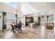 Open floor plan showcasing the kitchen, dining area, and dark wood flooring that brightens up the space at 3834 Donnington Cir, Castle Rock, CO 80104