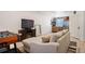 Open living area with a comfy couch and a wet bar, perfect for entertaining at 3834 Donnington Cir, Castle Rock, CO 80104