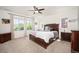 Bedroom with plush carpet, a ceiling fan, and lots of natural light from the three windows at 3834 Donnington Cir, Castle Rock, CO 80104