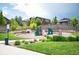 Community playground with climbing structures, a slide, and a grassy area, perfect for Gathering fun at 3834 Donnington Cir, Castle Rock, CO 80104