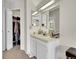 Small bath with storage and a white single sink vanity at 266 S Nome St, Aurora, CO 80012