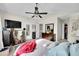 This bedroom features neutral paint, vaulted ceiling, and a ceiling fan at 266 S Nome St, Aurora, CO 80012