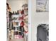 Walk-in closet featuring built-in shelves and ample storage space at 266 S Nome St, Aurora, CO 80012