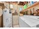 Laundry area with a water heater, washer, and dryer at 266 S Nome St, Aurora, CO 80012