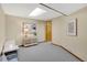 Finished basement space features neutral paint, carpet, ample lighting, and a convenient storage area at 16750 E Prentice Ave, Centennial, CO 80015