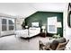 Primary bedroom showcasing a modern color scheme, cozy furniture, and abundant natural light at 16750 E Prentice Ave, Centennial, CO 80015