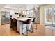 Modern kitchen with an island, stainless steel appliances, and bright white and gray cabinets at 16750 E Prentice Ave, Centennial, CO 80015