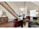 Stunning open living area with hardwood floors, stylish decor, natural lighting, and a view to the bedroom at 16750 E Prentice Ave, Centennial, CO 80015