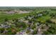 Aerial view of a neighborhood with well-maintained houses, green spaces, and a mix of residential and commercial areas at 154 Falcon Cir, Mead, CO 80542