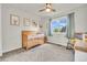 A bedroom with neutral tones, a crib, artwork, and a rocking chair at 154 Falcon Cir, Mead, CO 80542