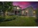 Charming two-story home with a well-manicured lawn, brick accents, covered porch, and attached two-car garage at 154 Falcon Cir, Mead, CO 80542