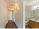 Hallway view into a bathroom with modern fixtures at 3825 Canyon Ranch Rd # 203, Highlands Ranch, CO 80126