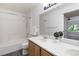 Bathroom with tub, shower, double sink vanity, and white countertops offers style and functionality at 3825 Canyon Ranch Rd # 203, Highlands Ranch, CO 80126