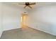 Spacious bedroom with neutral carpet, ceiling fan, and closet access offers a comfortable living space at 3825 Canyon Ranch Rd # 203, Highlands Ranch, CO 80126