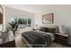 Comfortable bedroom featuring ample natural light and stylish furnishings for a relaxing space at 3825 Canyon Ranch Rd # 203, Highlands Ranch, CO 80126