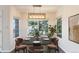 Elegant dining area featuring a modern chandelier and large windows, perfect for entertaining at 3825 Canyon Ranch Rd # 203, Highlands Ranch, CO 80126