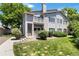 Exterior view of a well-maintained two-story home with a cozy porch and manicured landscaping at 3825 Canyon Ranch Rd # 203, Highlands Ranch, CO 80126