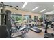 Community gym featuring modern fitness equipment and large windows with serene views at 3825 Canyon Ranch Rd # 203, Highlands Ranch, CO 80126
