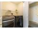 Convenient laundry area with modern washer and dryer at 3825 Canyon Ranch Rd # 203, Highlands Ranch, CO 80126