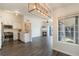 Bright open-concept living room featuring a modern kitchen and cozy fireplace at 3825 Canyon Ranch Rd # 203, Highlands Ranch, CO 80126