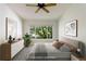 Serene primary bedroom with a large window and neutral decor, offering a peaceful retreat at 3825 Canyon Ranch Rd # 203, Highlands Ranch, CO 80126