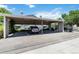 Community carport offers covered parking spaces for residents' convenience and protection from the elements at 3825 Canyon Ranch Rd # 203, Highlands Ranch, CO 80126