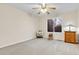 Serene bedroom with plush carpeting, a bright window, and a classic wooden dresser at 492 E 131St Ave, Thornton, CO 80241