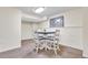 Inviting dining area with modern table and chairs, complemented by neutral wall art at 492 E 131St Ave, Thornton, CO 80241