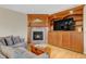 Comfortable living room with a fireplace, custom built-ins, and a cozy seating area for relaxing evenings at 492 E 131St Ave, Thornton, CO 80241