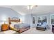 Serene main bedroom with vaulted ceilings, large windows, sitting area, and a calming color scheme at 492 E 131St Ave, Thornton, CO 80241