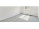 Sunlit bedroom with neutral carpeting and freshly painted white walls at 9742 Cathay St, Commerce City, CO 80022