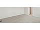 Spacious bedroom with neutral carpeting and freshly painted white walls at 9742 Cathay St, Commerce City, CO 80022