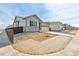 Charming single Gathering home features a two-car garage and stone exterior accents at 9742 Cathay St, Commerce City, CO 80022