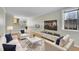Comfortable living room with modern furniture, a plush rug, hardwood floors, and lots of natural light at 783 Eudora St, Denver, CO 80220