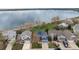 Aerial view of lakeside homes featuring manicured lawns and mature trees at 4814 S Upham Ct, Littleton, CO 80123