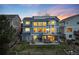 Spacious backyard with a deck, hot tub, and spiral staircase at 4814 S Upham Ct, Littleton, CO 80123