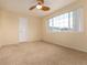 Neutral bedroom with a ceiling fan, and carpet floor at 4814 S Upham Ct, Littleton, CO 80123