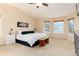 Spacious bedroom with a king bed, bay windows, and a ceiling fan at 4814 S Upham Ct, Littleton, CO 80123
