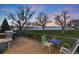 Enjoy the lake view from this deck, which features a barbecue grill and outdoor seating at 4814 S Upham Ct, Littleton, CO 80123