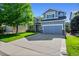 Charming two-story home with a well-maintained lawn and a long driveway at 4814 S Upham Ct, Littleton, CO 80123