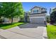 Charming two-story home with a well-maintained lawn, an attached two-car garage, and beautiful curb appeal at 4814 S Upham Ct, Littleton, CO 80123