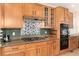 Gourmet kitchen with granite countertops, gas cooktop, and stainless steel appliances at 4814 S Upham Ct, Littleton, CO 80123