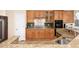 Well-equipped kitchen featuring granite counters, stainless steel appliances, and ample cabinet space at 4814 S Upham Ct, Littleton, CO 80123
