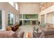 Spacious living room featuring large windows, a fireplace, and comfortable seating at 4814 S Upham Ct, Littleton, CO 80123
