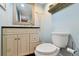 Classic powder room featuring blue walls, modern vanity, and elegant fixtures at 19131 E Garden Pl, Centennial, CO 80015