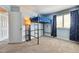 Bright bedroom featuring a steel frame loft bed, complemented by neutral carpet and blue colored walls at 19131 E Garden Pl, Centennial, CO 80015