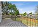 A backyard deck with a view of the neighborhood with a wood fence at 19131 E Garden Pl, Centennial, CO 80015