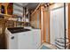 Functional laundry room with modern appliances and exposed structural components for easy access at 19131 E Garden Pl, Centennial, CO 80015